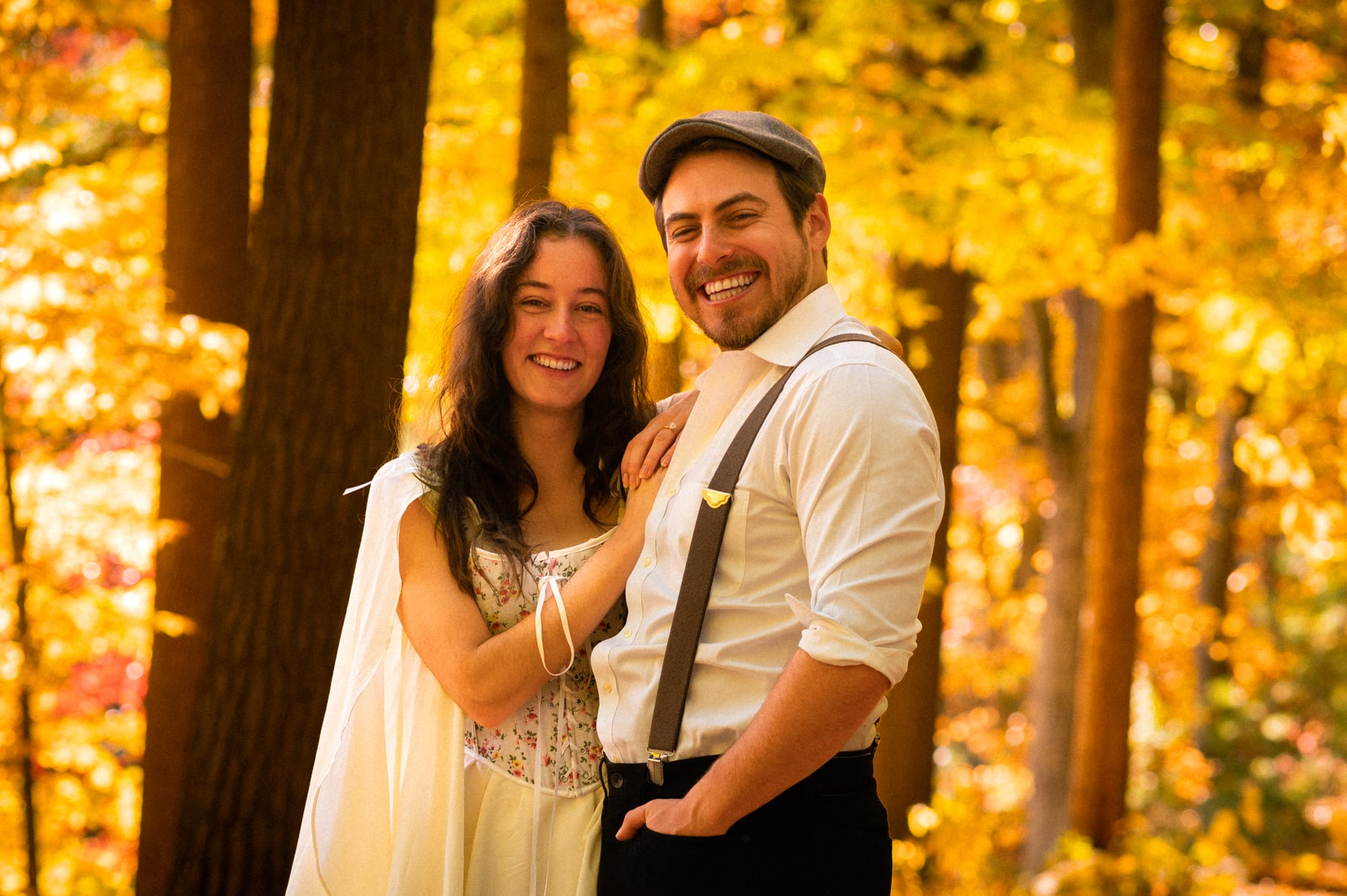 A final golden-hour frame of the couple in the woods